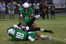 (THOMAS WALLNER | THE GRAHAM LEADER) Keyton Newland makes a tackle on one of his opponents during a Bobcat matchup earlier in the season. The Bobcats will continue to need players like Newland to rise up as they advance further into district play. 