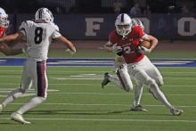 (ALEX HAVARDANSKY | THE GRAHAM LEADER) Macrae Menard returns a ball after getting an interception Friday, Oct. 17  against Bridgeport. Menard snagged two interceptions on the day and also helped keep the game scoreless on a botched field goal attempt from the Bulls. 