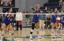 (ALEX HAVARDANSKY | THE GRAHAM LEADER) Madison Cauble, 2, Kya Cooper, 8, and Katy McGehee, 1, all line up in the front row for a serve receive opportunity in one of the Lady Blues matches. Each of these players have provided a strong starting presence for the team all season.  