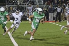 (ALEX HAVARDANKSY | THE GRAHAM LEADER) Keyton Newland runs to the outside Friday, Nov. 21 in the Bobcats’ area round playoff matchup. Newland won district defensive most valuable player, as well as being recognized as a first team all district running back and kicker.
