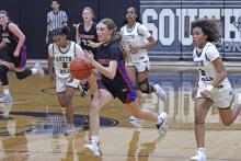 (TC GORDON | THE GRAHAM LEADER) Lady Blues sophomore Katie McGehee drives down the court on a fastbreak after stealing the ball Tuesday, Nov. 12 during Graham’s 60-18 win over South Hills.