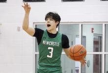 (ASHLEY ANDERSON | JACKSBORO HERALD-GAZETTE) Keyton Newland commands the offense Thursday, Feb. 19 against the Bryson Cowboys. The Bobcats went into the playoffs with momentum after defeating the Cowboys 53-36. 