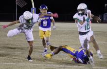 (ASHLEY ANDERSON | THE GRAHAM LEADER) Keyton Newland runs around the corner with the ball in one of the Bobcats matchups earlier in the season. The Bobcats became Bi-District champions after defeating the Petersburg Buffaloes in their matchup Friday, Nov. 14.