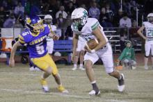 (ASHLEY ANDERSON | JACKSBORO HERALD-GAZETTE) Rylan Hinojosa runs a ball back against Bryson in their matchup Friday, Nov. 7. Hinojosa had a sack as well as a forced fumble and a defensive score. 