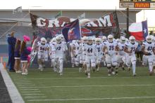The Graham Steers take the field for the district opener at Iowa Park on Oct. 11. The Steers suffered their first loss to Iowa Park since 2005. Leader photo by Mike Williams