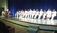 LVN graduates listen as Amanda Sallee, LVN graduate, welcomes friends, family, faculty and staff to the pinning ceremony Aug. 9. (Photos courtesy of NCTC)