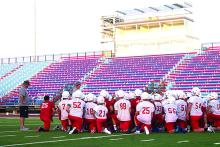 Steers head coach Kenny Davidson addresses his team before practice Monday. With their new stadium and field, the Steers’ first official practice of the season featured a lot of energy. Davidson hopes that energy will continue throughout the week.