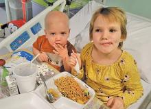 (CONTRIBUTED PHOTO | SHARON MARTIN) Three-year-old Tommy Martin eats with his sister Sarah in a the hospital. On Dec. 27, 2020, Tommy was diagnosed with B-cell Acute Lymphoblastic Leukemia and remains in treatment.