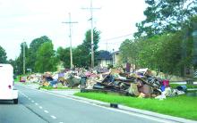 The entire contents of homes, destroyed by August floods in Baton Rouge, La., lined the streets as far as the eye could see when a group from Graham arrived to lend assistance.