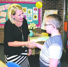 Susan Riley welcomes Aidan Adams to her fifth grade English Language Arts class at Woodland Elementary School during Meet the Teacher events held Thursday afternoon and evening at Graham ISD schools. (Leader photos by Cheryl Adams)