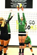 K.C. Shields get a block during the Ladycats final set against the Dragons