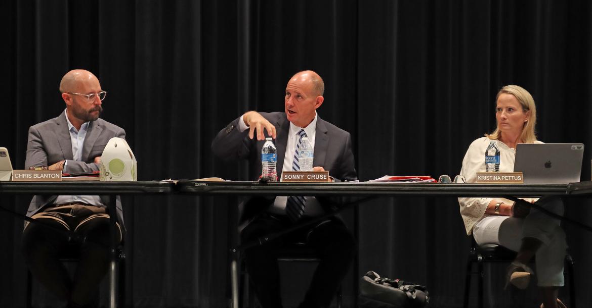 (THOMAS WALLNER | THE GRAHAM LEADER) GISD Superintendent Sonny Cruse speaks with the board of trustees Wednesday, May 15. Shown from left to right are Board President Chris Blanton and Cruse.